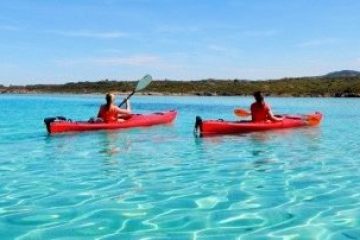 a small boat in a body of water