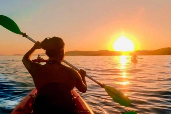 a sunset over a body of water
