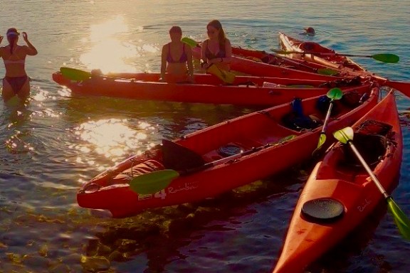a group of people on a boat in the water