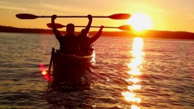 a close up of a boat next to a body of water
