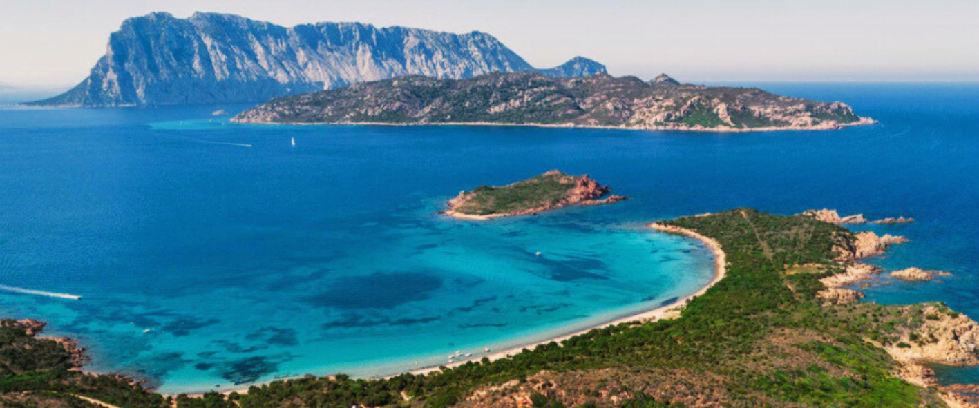 bay a large body of water with a mountain in the background