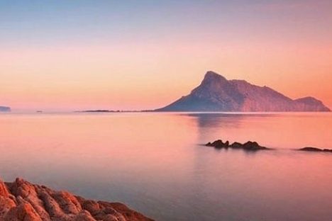 a sunset over a body of water