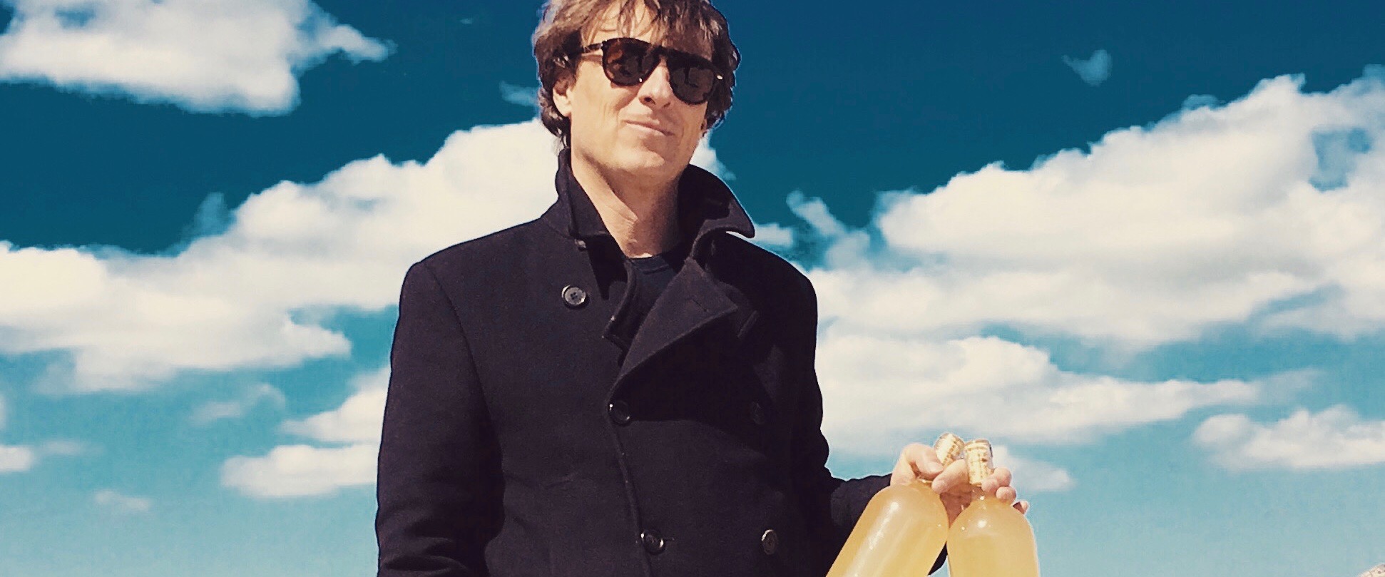 a person wearing sunglasses posing for the camera