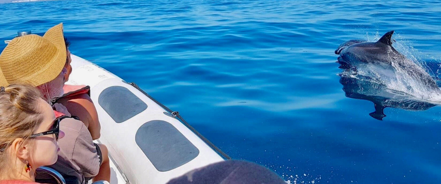 Progetto senza titolo2 a person sitting on a boat in the water