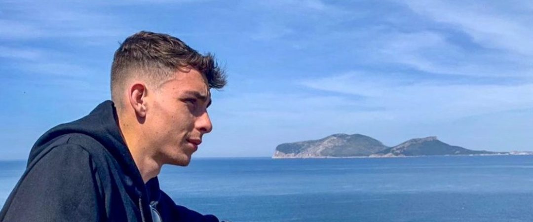 a man standing in front of a body of water