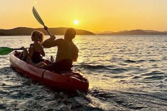 a man in a boat on a body of water