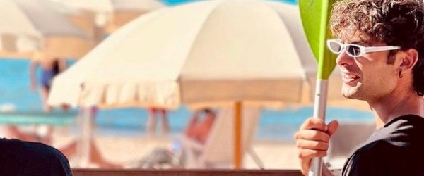 a person wearing sunglasses and a hat