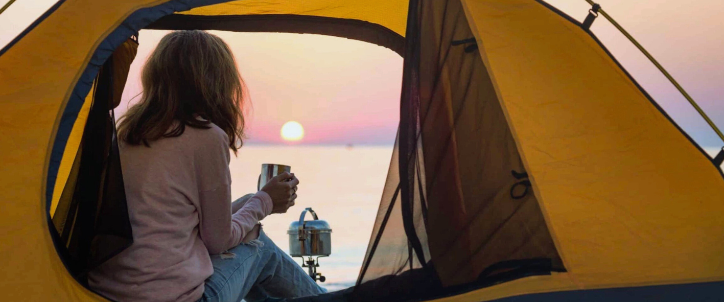 tend-3 a person standing in front of a tent