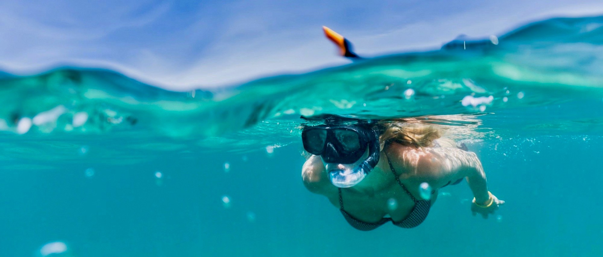 a person swimming in a pool of water