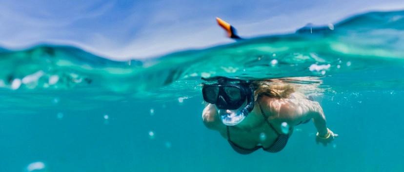 a person swimming in a pool of water