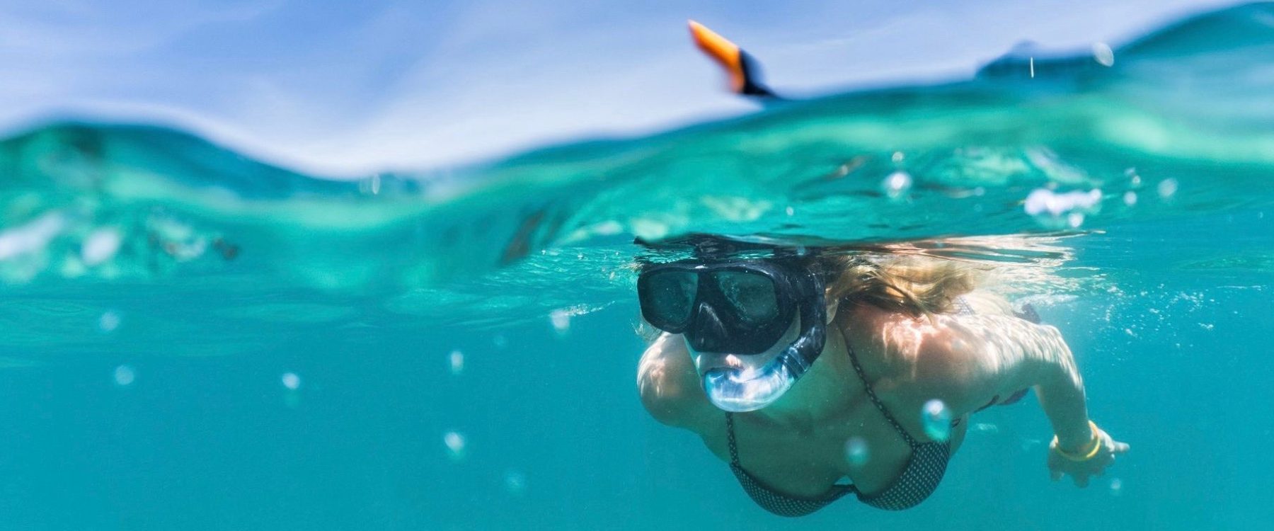 a person swimming in a pool of water