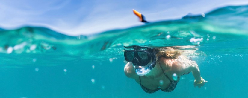 a person swimming in a pool of water