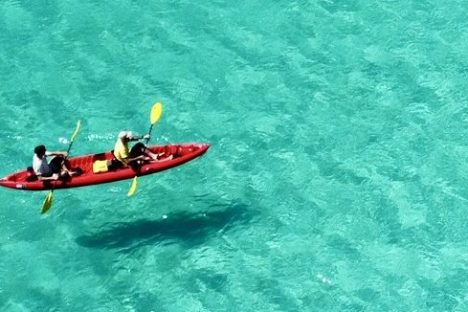 a plane flying over a body of water